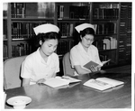 Japanese Nurses Studying In The Library by Atomic Bomb Casualty Commission