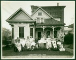 Children In Front of Memorial Hospital's Cottage for Sick and Crippled Children On Christmas Eve by Memorial Hospital System