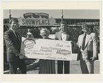 Dr. Desmond Accepting Fundraising Check for Texas Children's Hospital at Hanna Barbera Land (Spring, Texas) by Murdina M. Desmond (1916-2003)