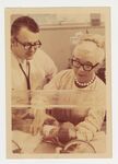 Dr. Paul Gillette and Dr. Murdina Desmond Examine an Infant in an Incubator by Murdina M. Desmond (1916-2003)