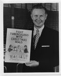 Red Schoendienst holding a Houston Anti-Tuberculosis League's Christmas Seal Campaign poster