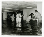 People Recovering Materials from a Flooded Space by Texas Medical Center