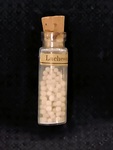 MS 121: Lachesis Bottle with Pills by A M. Autrey Jr (1899-1983)